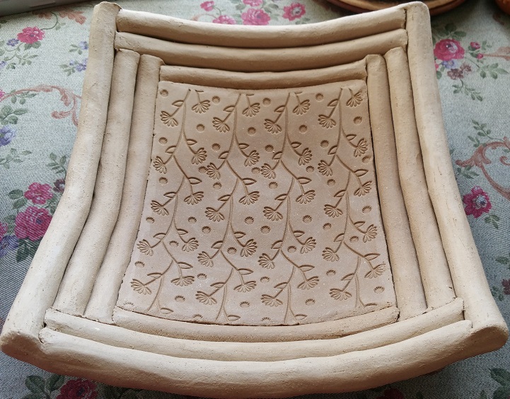 Slab and coil pot by Row - Pattern is from a large rubber stamp map